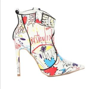 Make A Bold Statement w/ these White Printed Boots